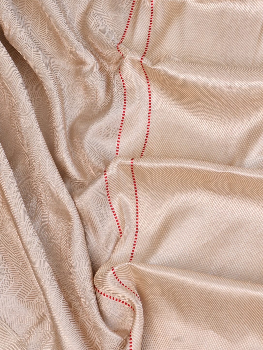 Soft ivory with a subtle champagne sheen and delicate red accents Mashru Kinkhab Banarasi saree border closeup