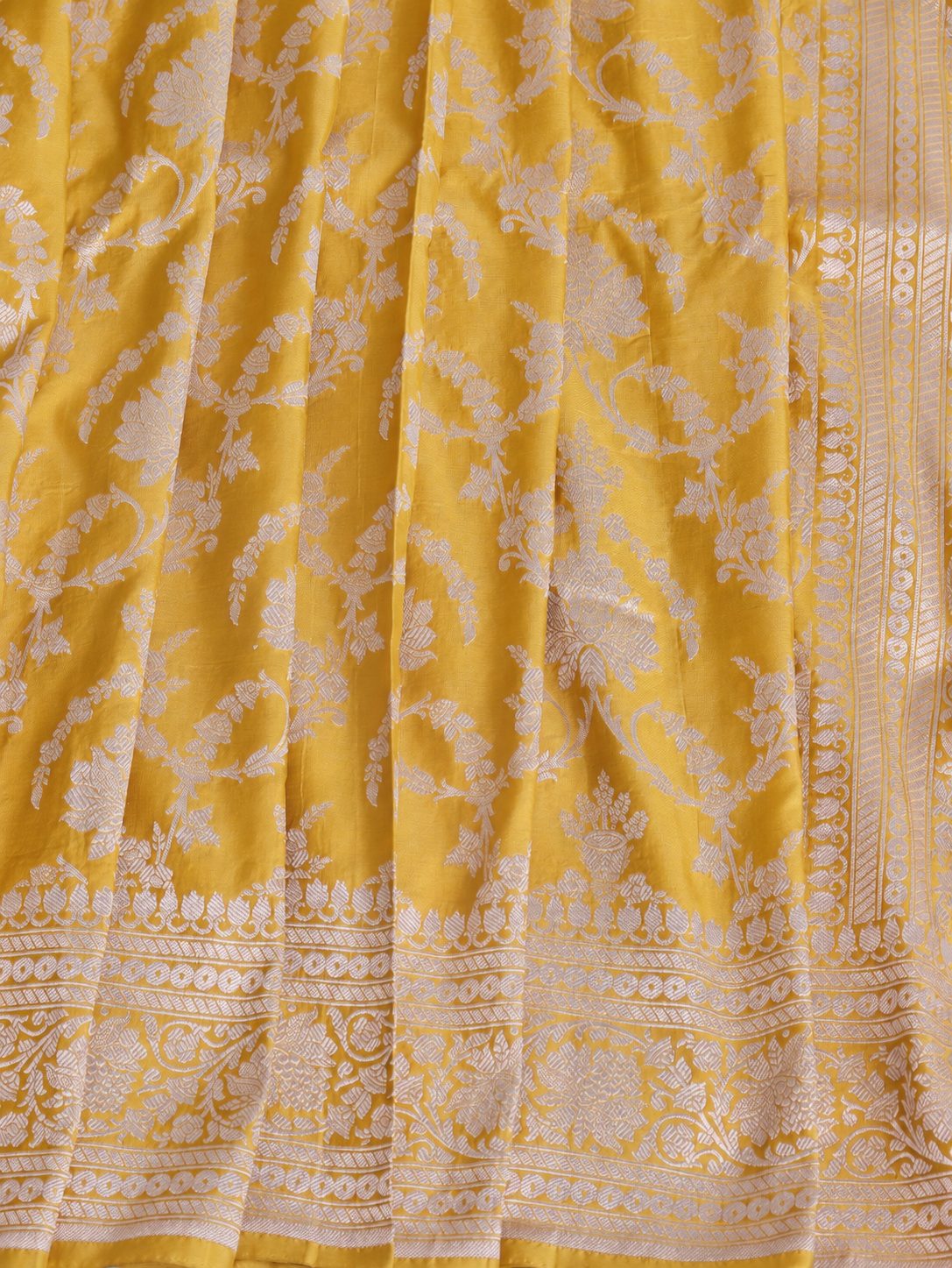 Rich haldi yellow with silver-toned woven detailing Katan Silk Banarasi saree full spread