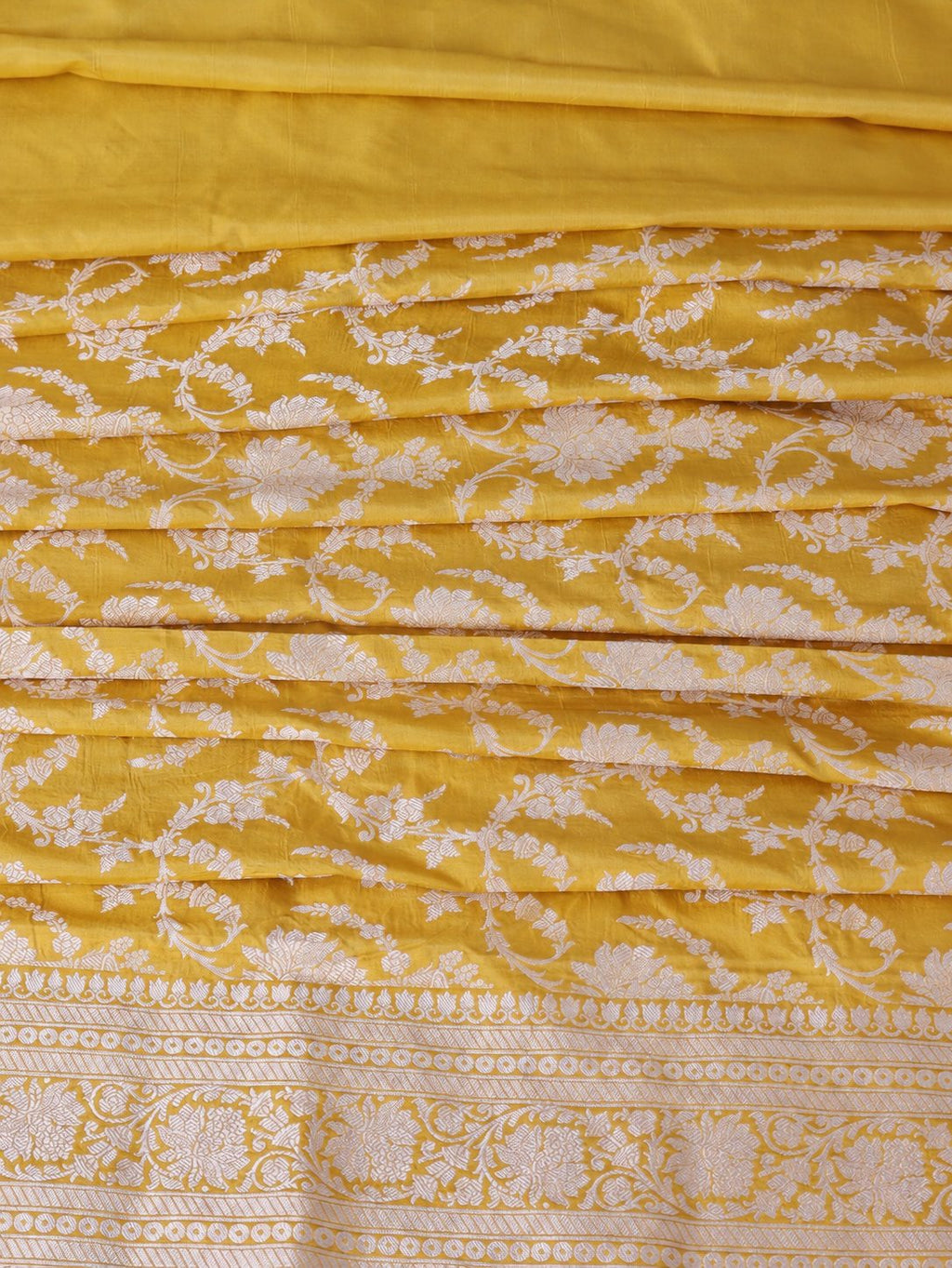 Rich haldi yellow with silver-toned woven detailing Katan Silk Banarasi saree front drape view