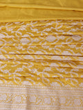 Rich haldi yellow with silver-toned woven detailing Katan Silk Banarasi saree front drape view