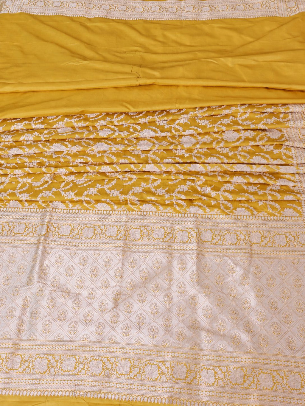 Rich haldi yellow with silver-toned woven detailing Katan Silk Banarasi saree pallu detail
