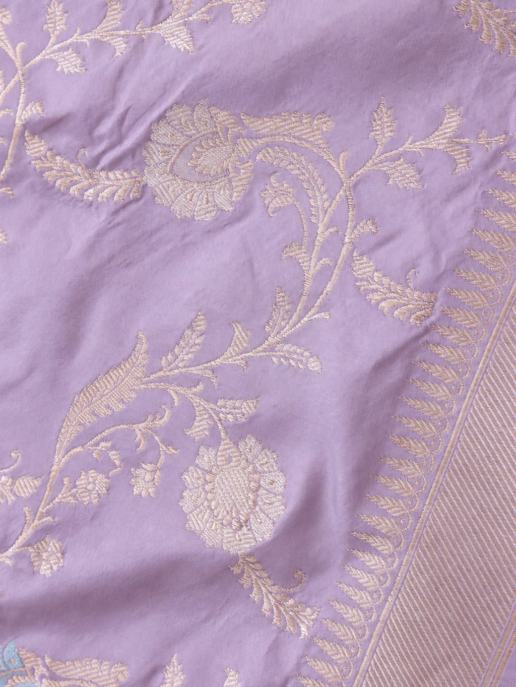 Soft lavender with pale gold zari and pastel pink, blue and mint-green floral accents Katan Silk Banarasi saree border closeup