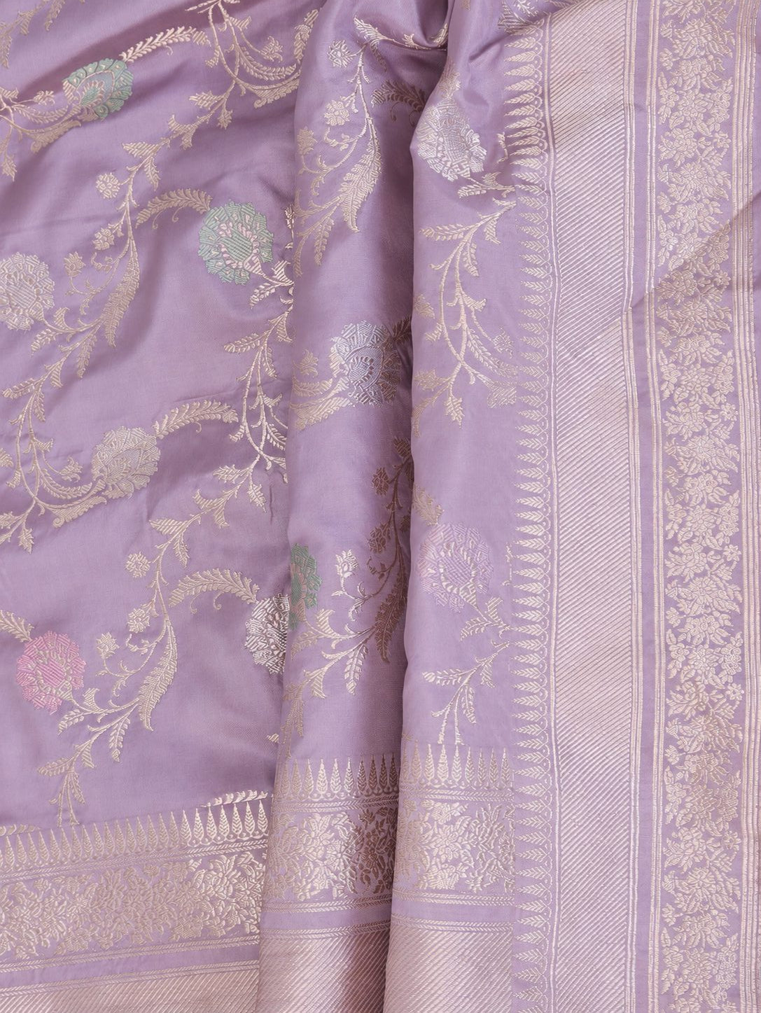 Soft lavender with pale gold zari and pastel pink, blue and mint-green floral accents Katan Silk Banarasi saree front drape view