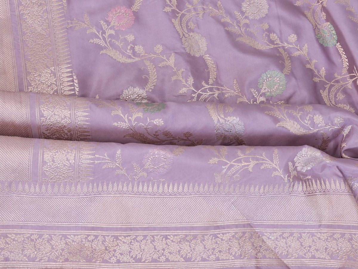 Soft lavender with pale gold zari and pastel pink, blue and mint-green floral accents Katan Silk Banarasi saree front drape view