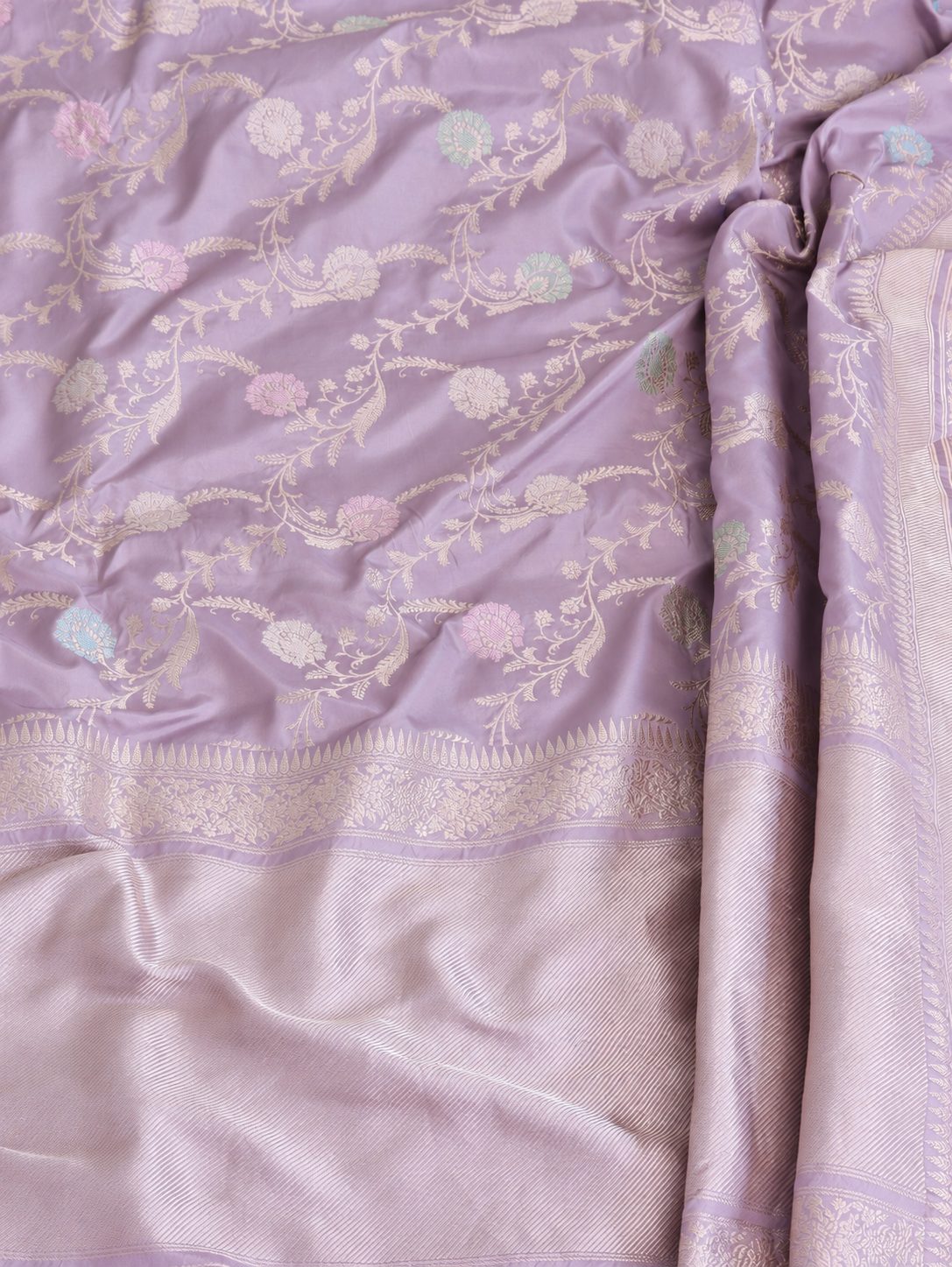 Soft lavender with pale gold zari and pastel pink, blue and mint-green floral accents Katan Silk Banarasi saree pallu detail