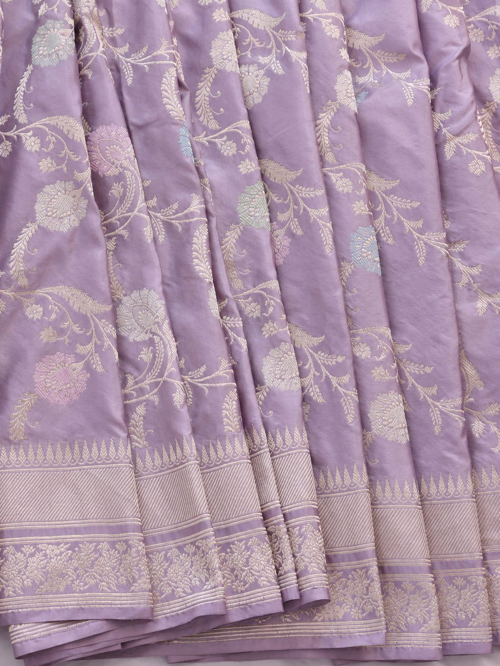 Soft lavender with pale gold zari and pastel pink, blue and mint-green floral accents Katan Silk Banarasi saree texture detail