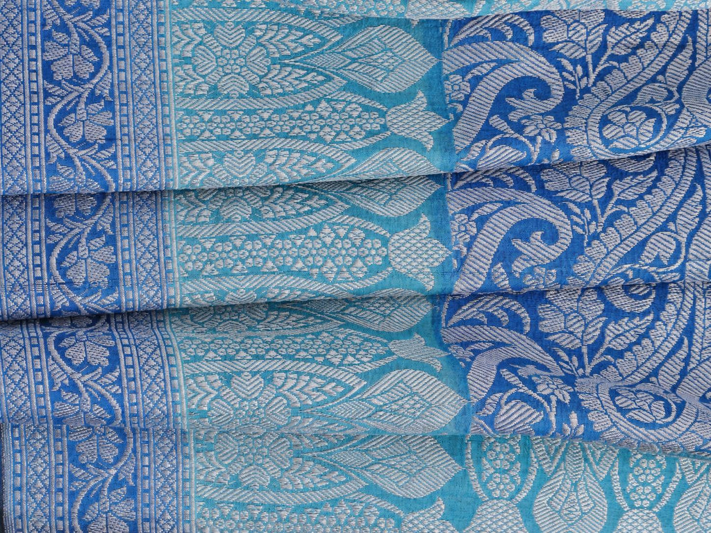 A soft steel-blue and aqua combination, complemented by a royal-blue pallu and silver-toned zari Tussar Silk Banarasi saree front drape view