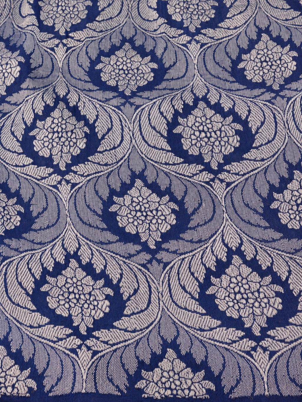 Soft aqua blue body with a contrasting royal blue pallu, blue floral detailing and touches of green Tussar Silk Banarasi saree pallu detail