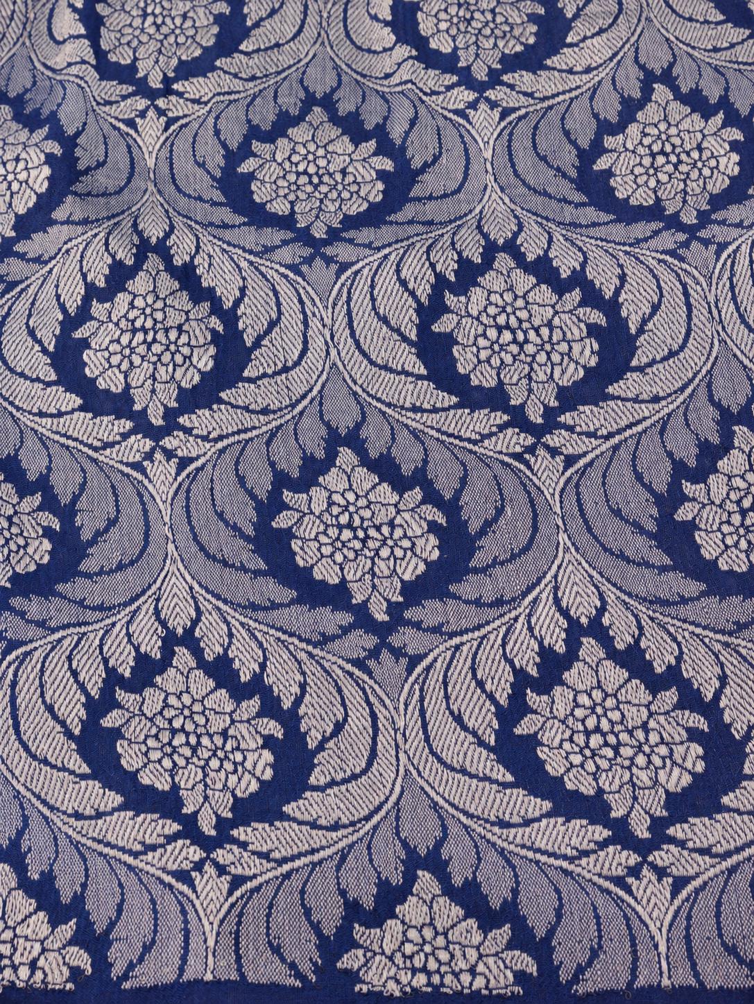Soft aqua blue body with a contrasting royal blue pallu, blue floral detailing and touches of green Tussar Silk Banarasi saree pallu detail