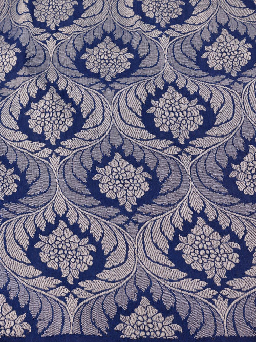 Soft aqua blue body with a contrasting royal blue pallu, blue floral detailing and touches of green Tussar Silk Banarasi saree pallu detail