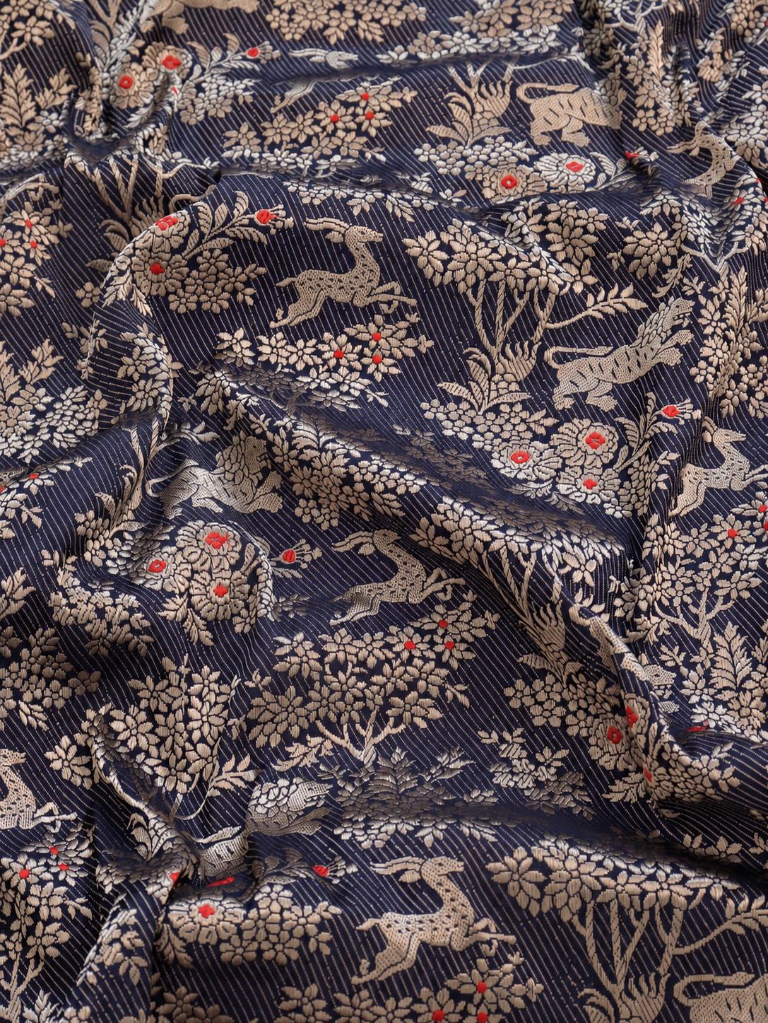 Deep navy blue with champagne gold zari and small red floral accents Katan Silk Banarasi saree border closeup