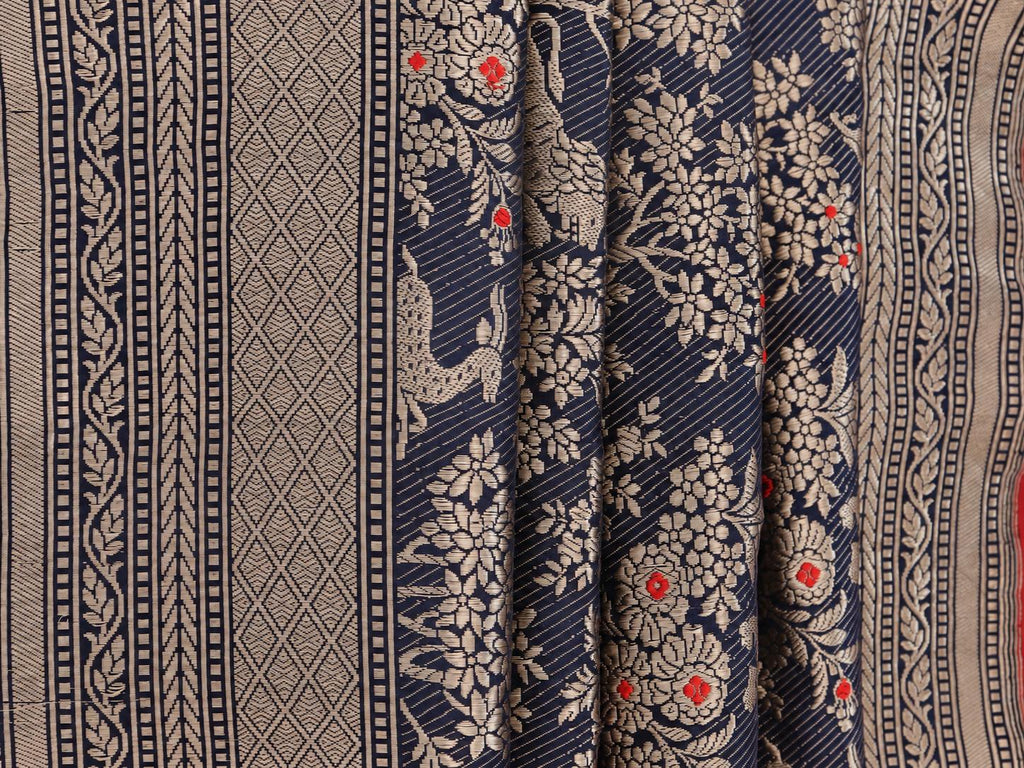 Deep navy blue with champagne gold zari and small red floral accents Katan Silk Banarasi saree pallu detail