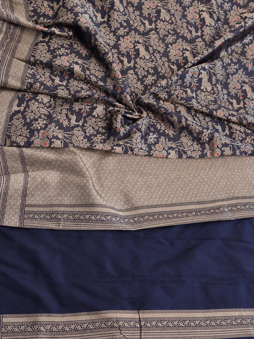 Deep navy blue with champagne gold zari and small red floral accents Katan Silk Banarasi saree front drape view