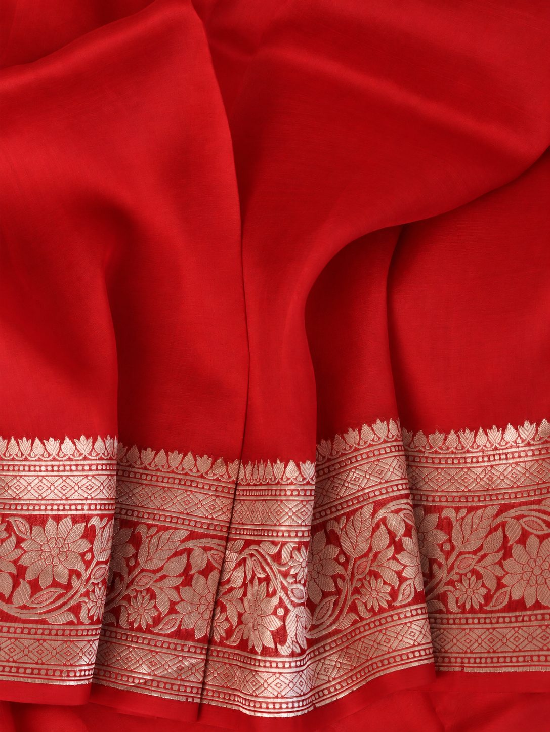 Rich vermilion red with softly contrasting metallic zari detailing Cora Chand Buta Saree Banarasi saree texture detail