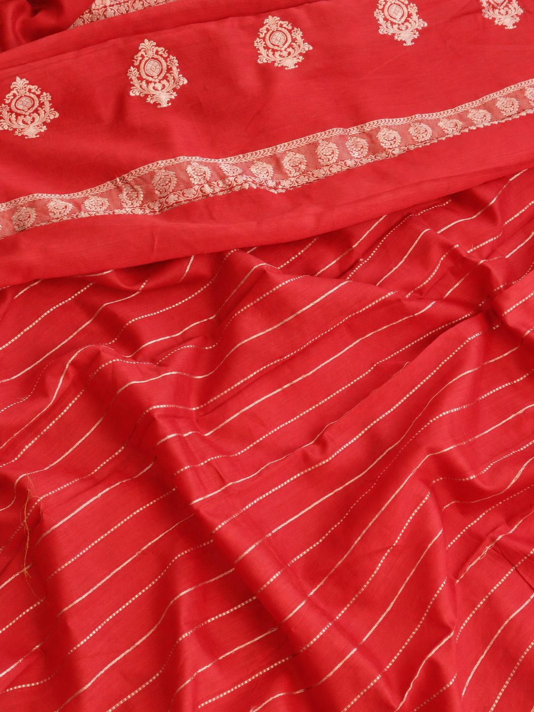 Vibrant vermilion red with delicate champagne-gold zari detailing Linen Cotton Banarasi saree pallu detail