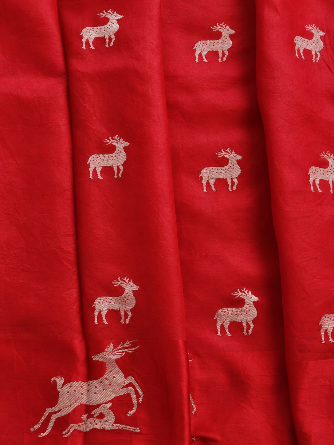 Rich cherry red with silver-toned woven detailing Soft Katan Banarasi saree border closeup