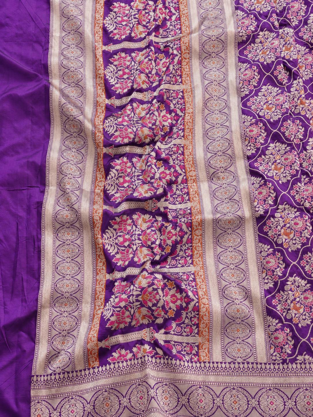 Rich royal purple with pale gold toned zari and vibrant pink and rust-orange floral accents Katan Silk Banarasi saree pallu detail