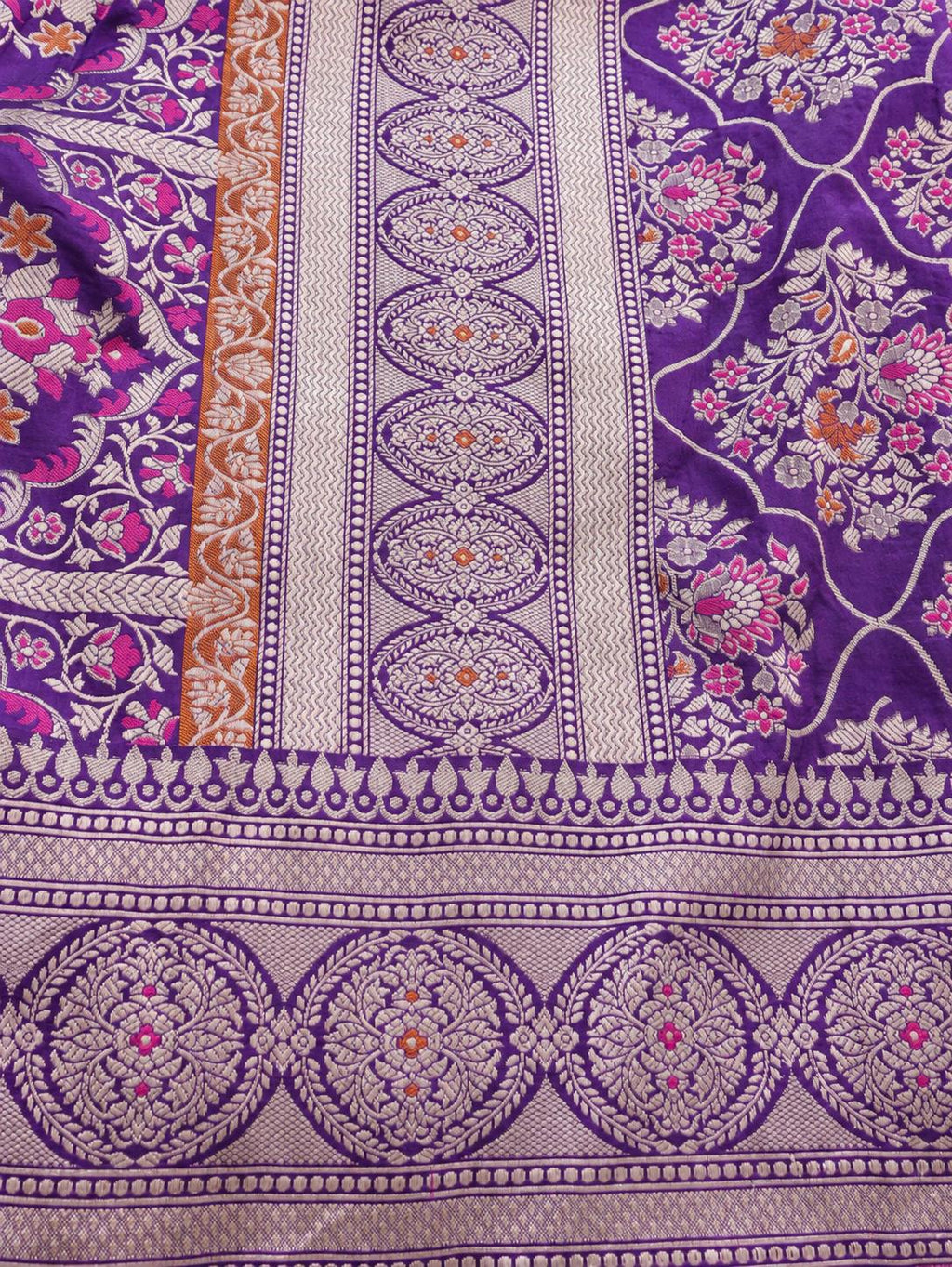 Rich royal purple with pale gold toned zari and vibrant pink and rust-orange floral accents Katan Silk Banarasi saree full spread