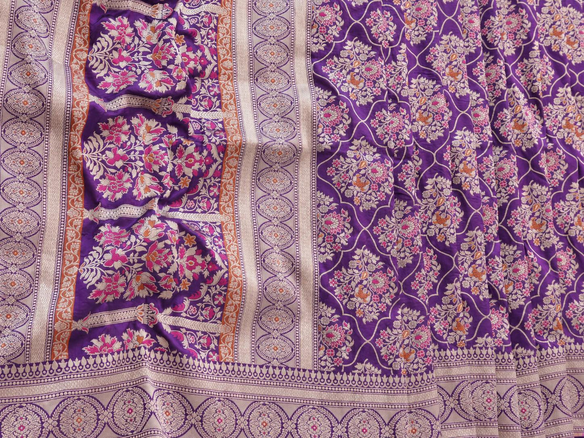 Rich royal purple with pale gold toned zari and vibrant pink and rust-orange floral accents Katan Silk Banarasi saree folded view