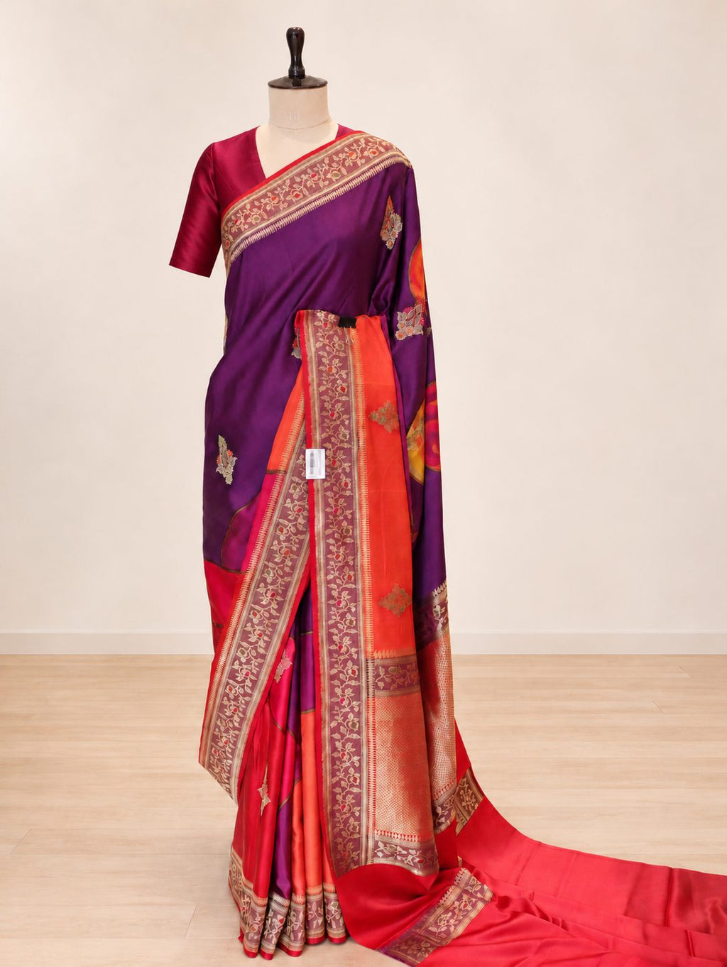 Wine magenta with contrasting red, orange and pink sections, highlighted by gold-toned zari. Katan Silk Banarasi saree front drape view