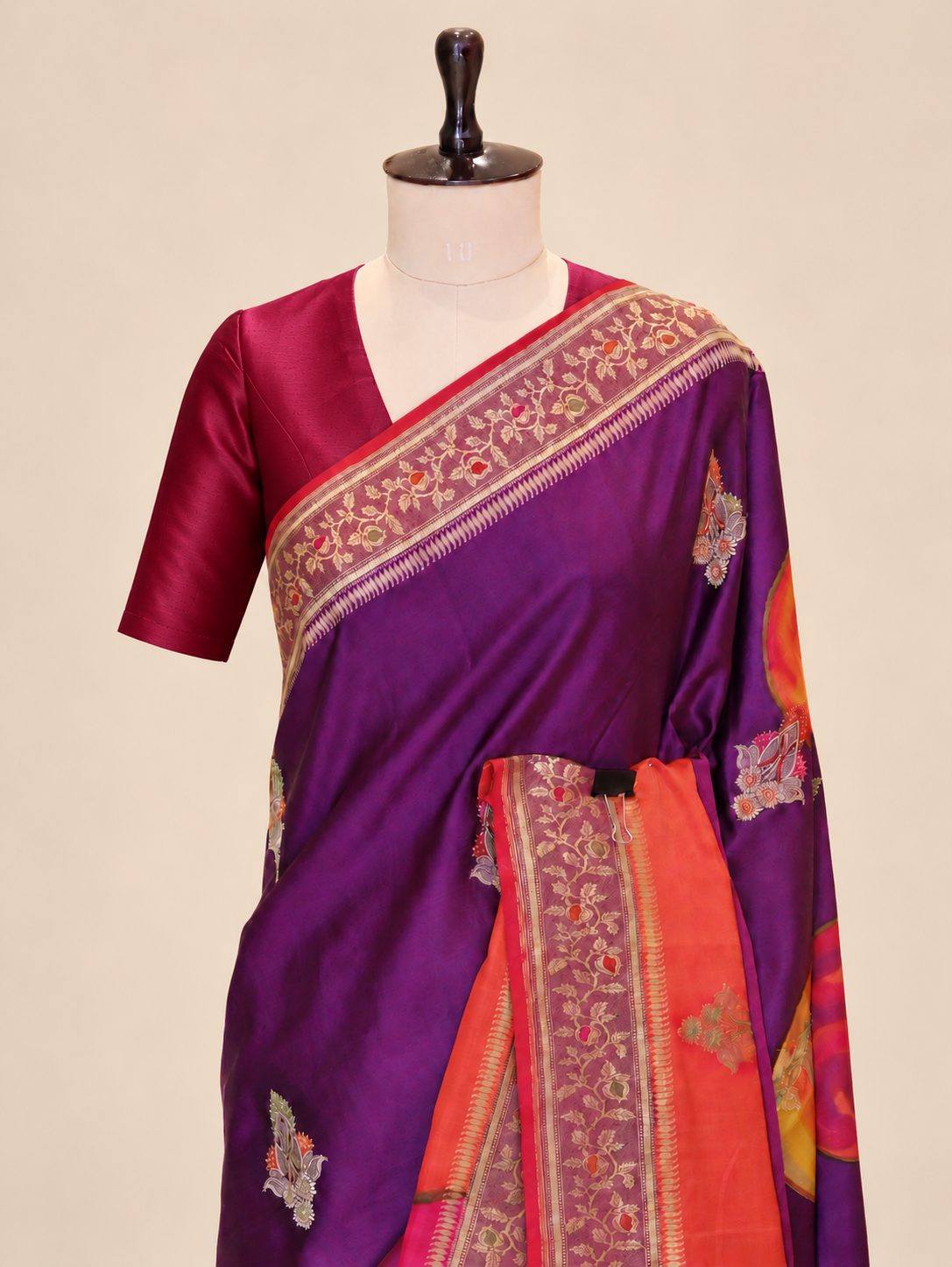 Wine magenta with contrasting red, orange and pink sections, highlighted by gold-toned zari. Katan Silk Banarasi saree pallu detail