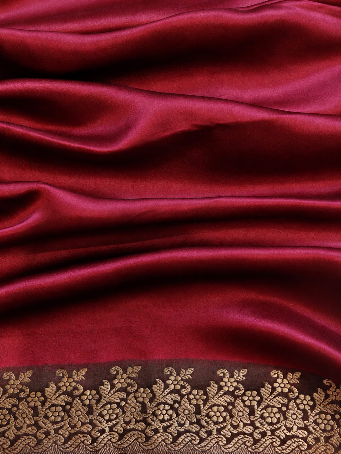 Wine magenta with contrasting red, orange and pink sections, highlighted by gold-toned zari. Katan Silk Banarasi saree zari work detail