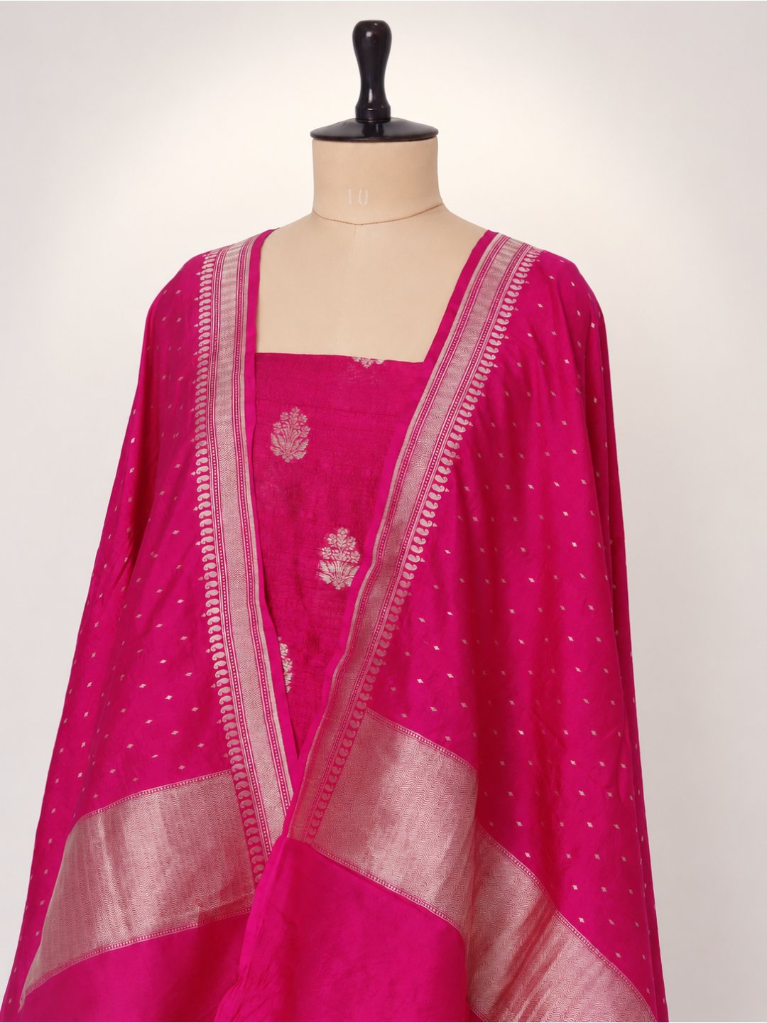 Rani pink with light gold zari. Dupion silk Banarasi suit texture detail