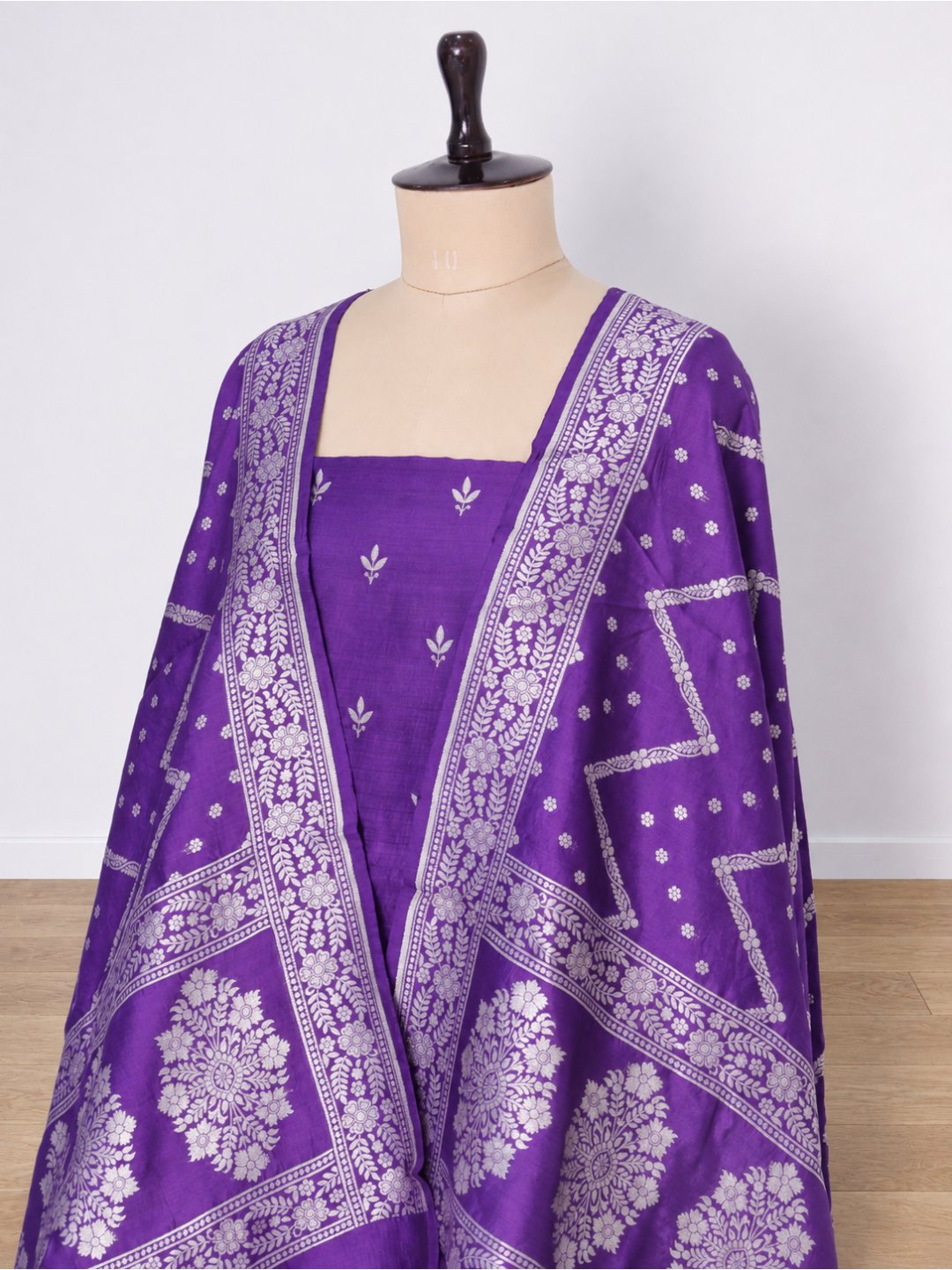 Violet-purple with silver-toned zari detailing. Moonga Silk Banarasi suit front drape view