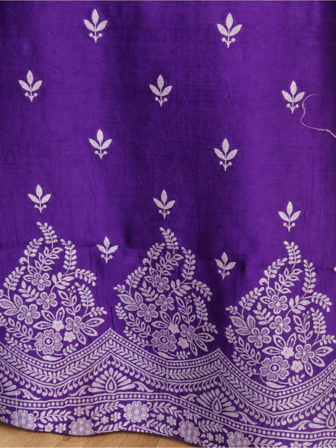 Violet-purple with silver-toned zari detailing. Moonga Silk Banarasi suit front drape view
