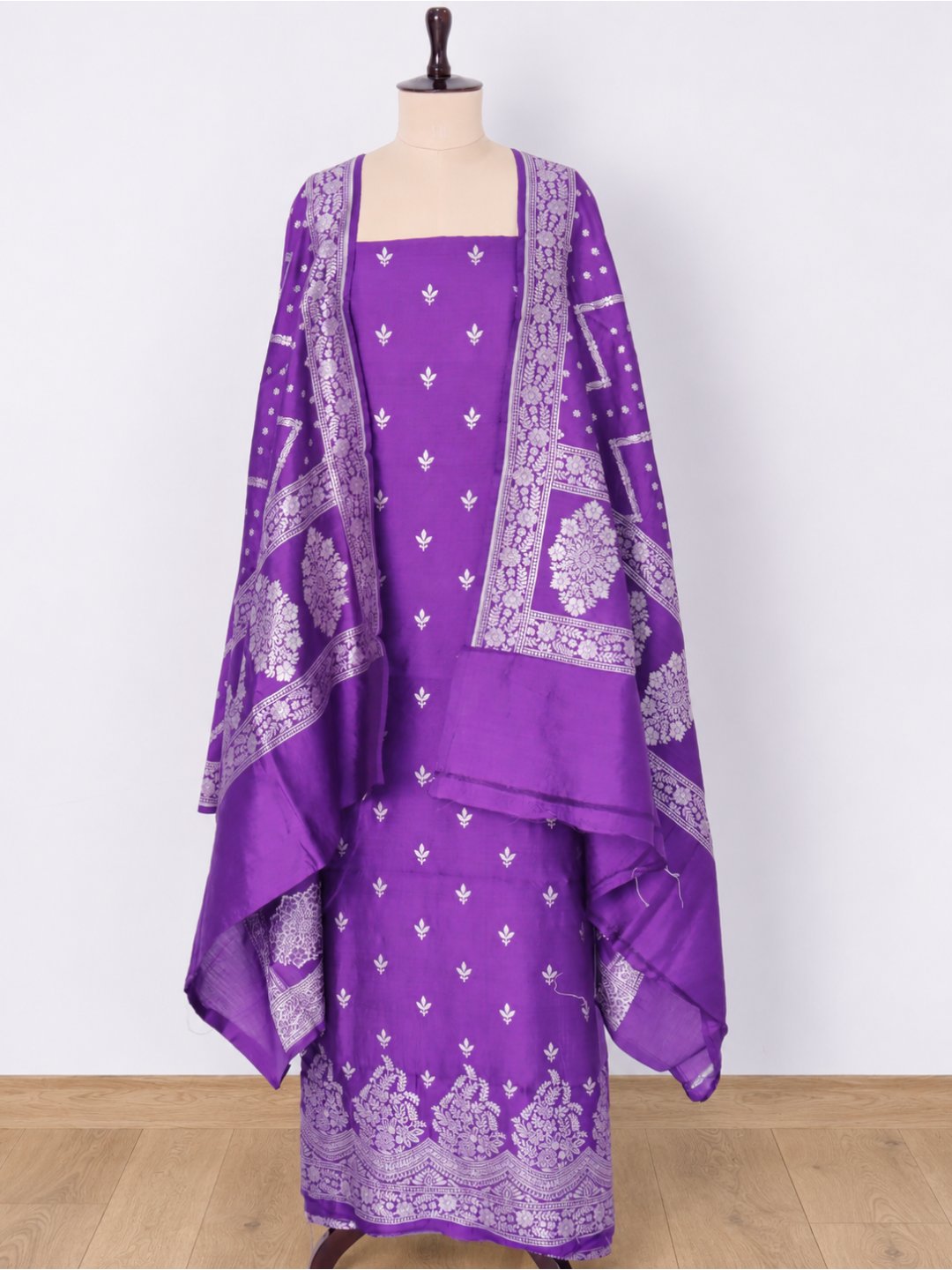 Violet-purple with silver-toned zari detailing. Moonga Silk Banarasi suit front drape view