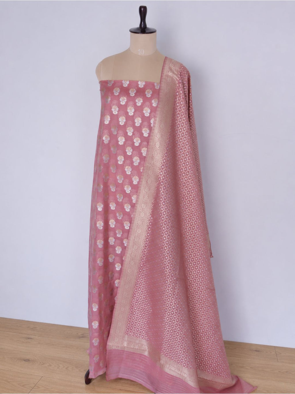 Colour: Muted rose pink with gold and silver-toned zari Chiniya Silk Banarasi suit front drape view