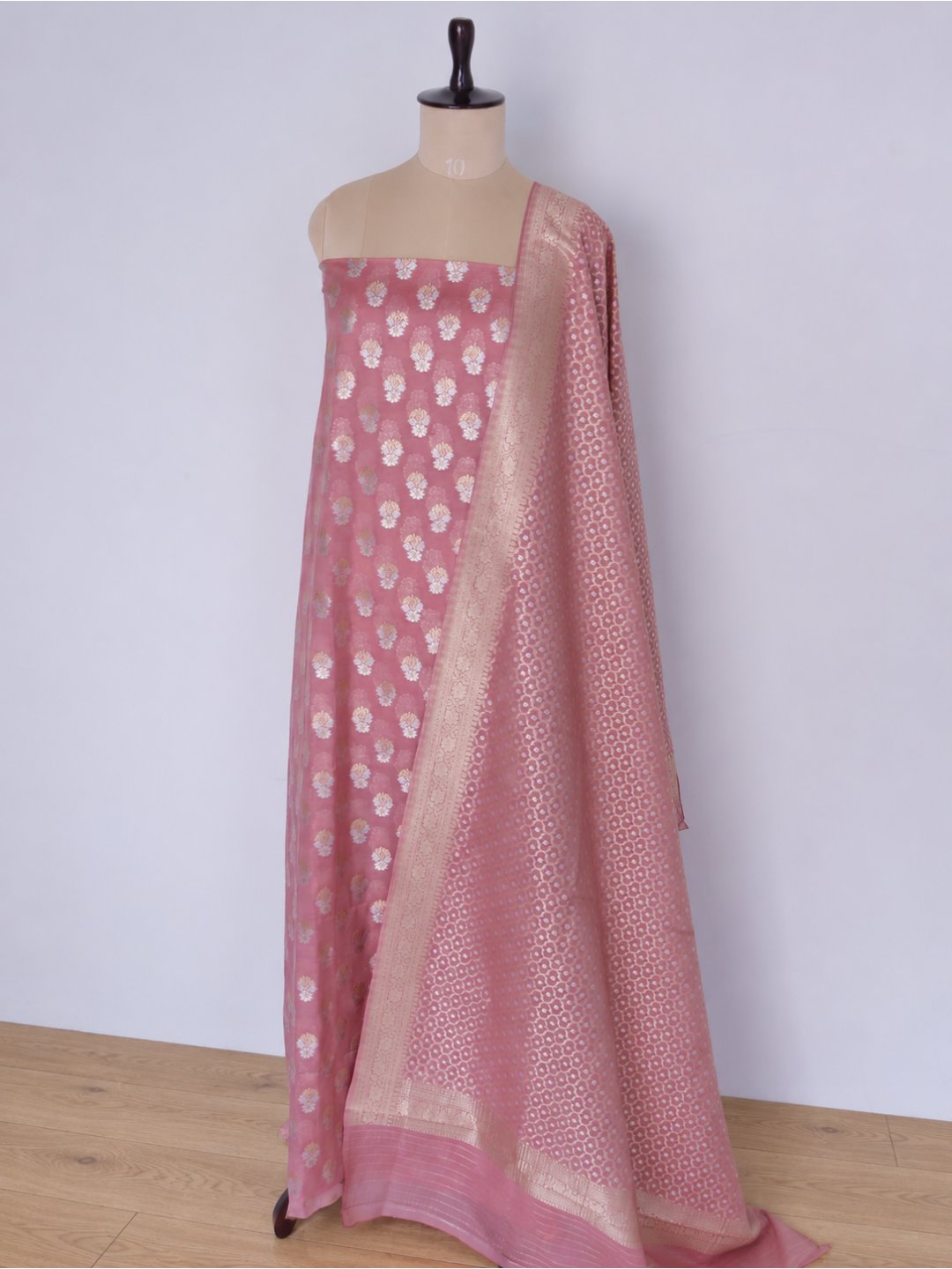 Colour: Muted rose pink with gold and silver-toned zari Chiniya Silk Banarasi suit front drape view