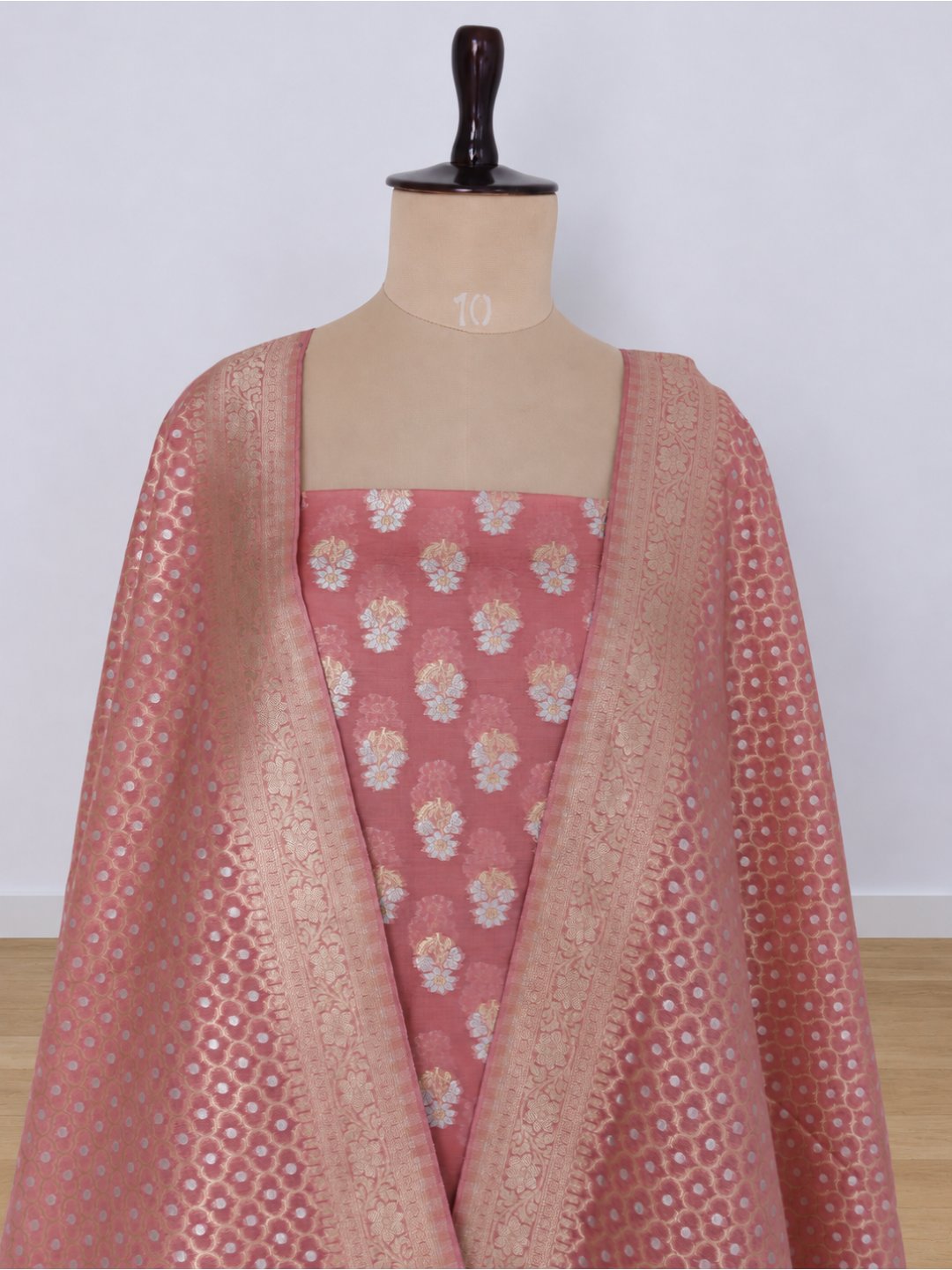 Colour: Muted rose pink with gold and silver-toned zari Chiniya Silk Banarasi suit neckline detail