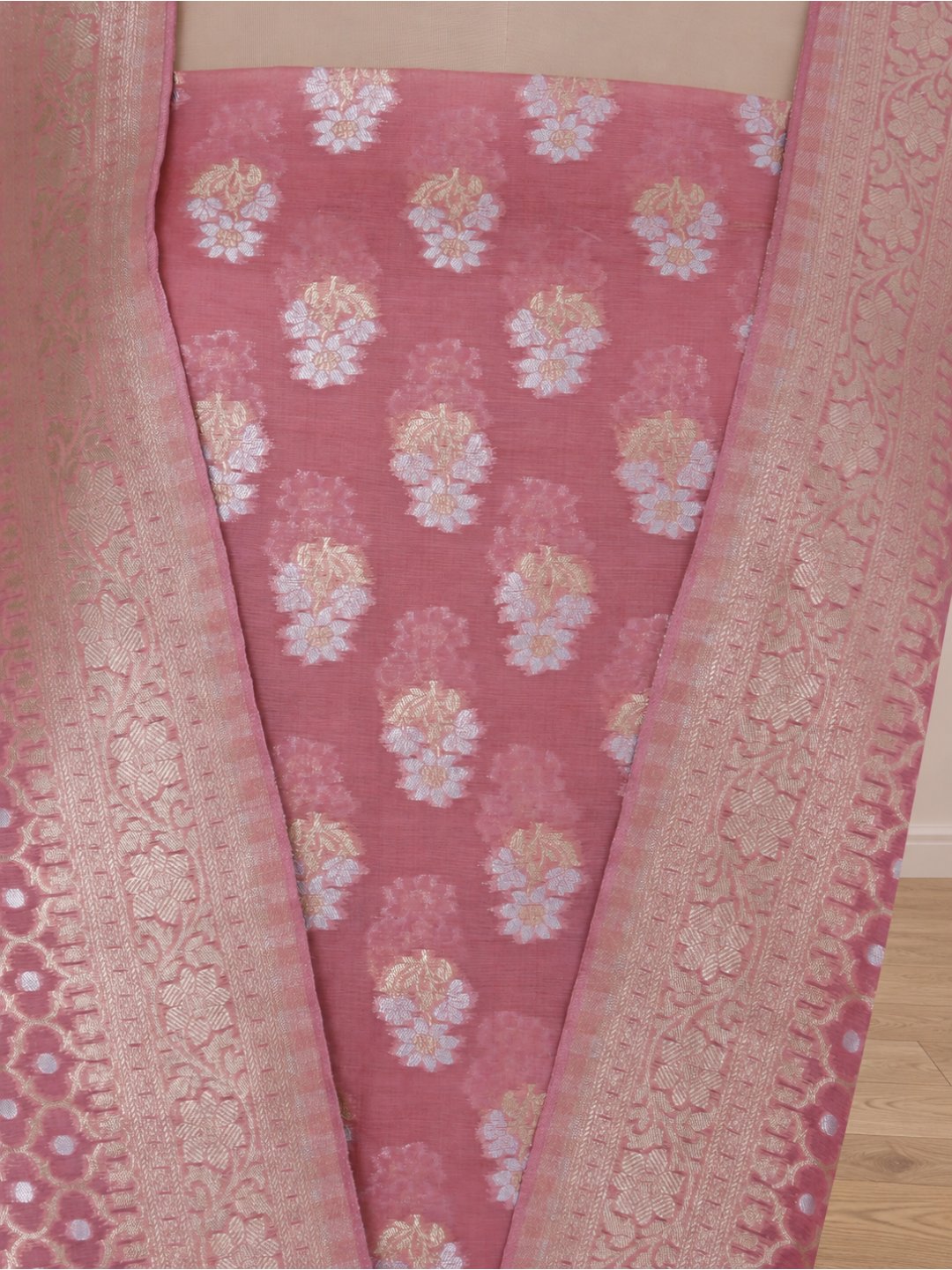 Colour: Muted rose pink with gold and silver-toned zari Chiniya Silk Banarasi suit bottom detail