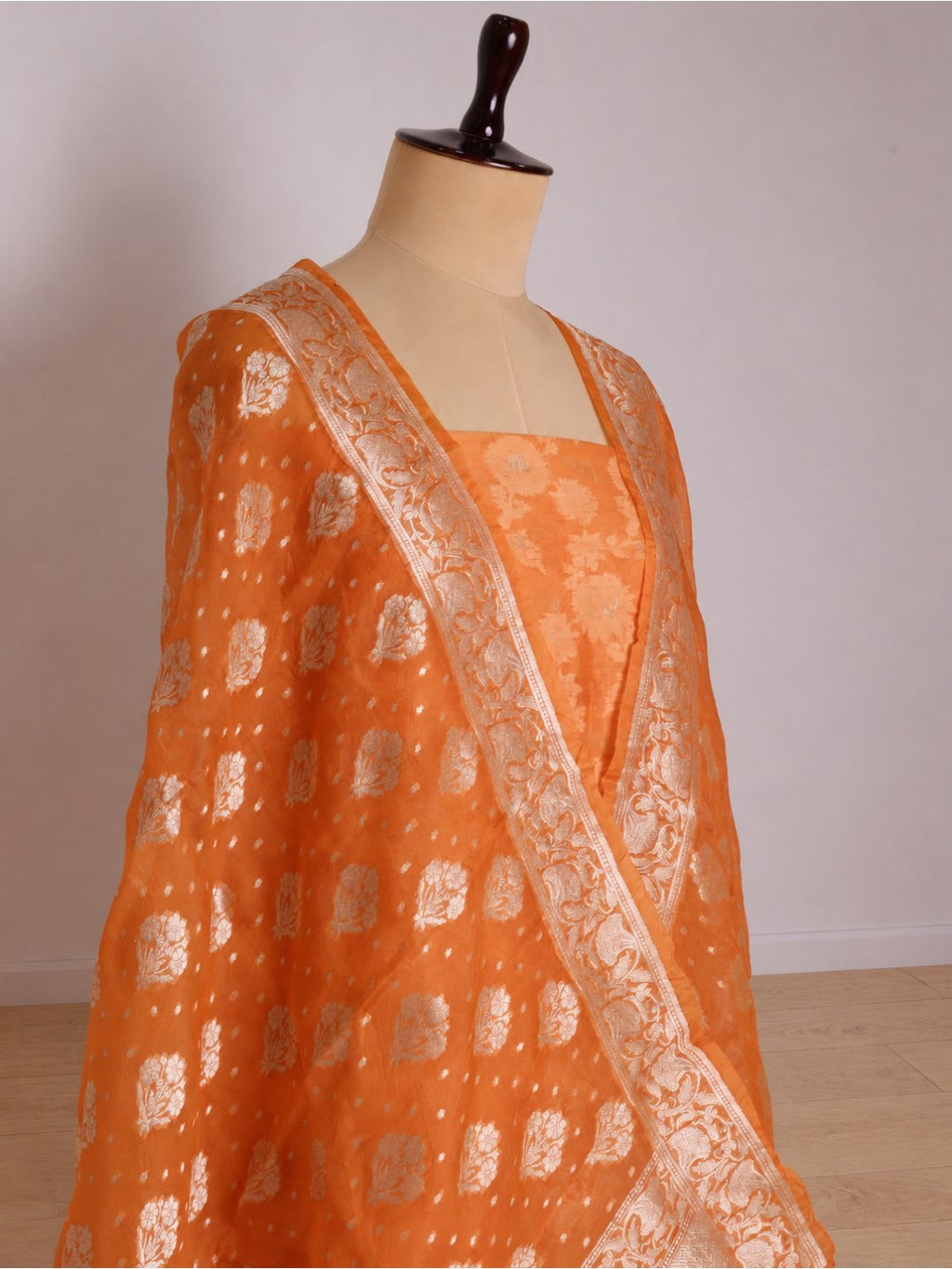 Warm orange with light gold-toned zari work. Chanderi suit Banarasi suit sleeve detail
