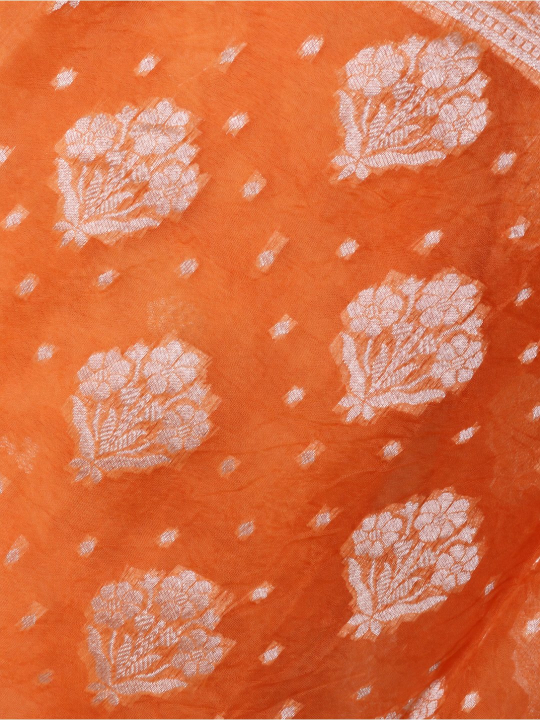 Warm orange with light gold-toned zari work. Chanderi suit Banarasi suit texture detail