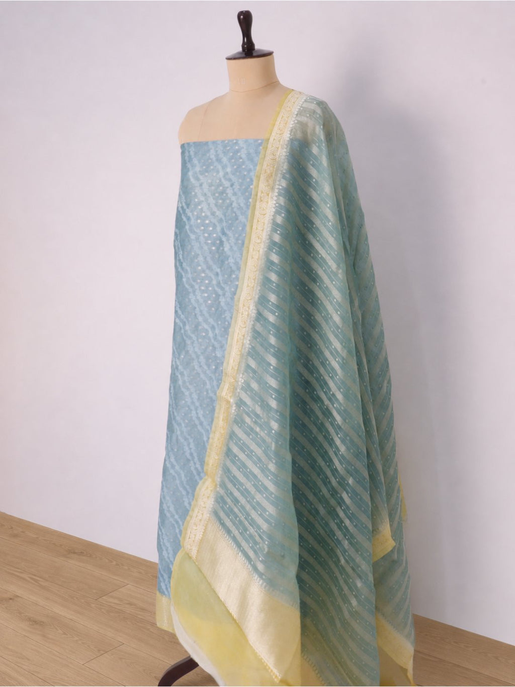 Powder blue with pale yellow borders Chanderi Banarasi suit folded view