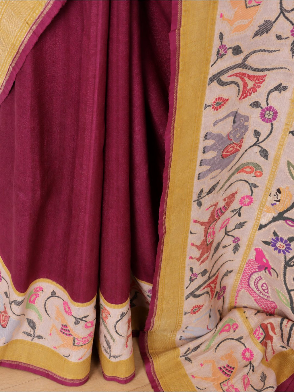 Deep wine body with a cream border, mustard-gold bands and multicoloured detailing Tussar Silk Banarasi saree texture detail