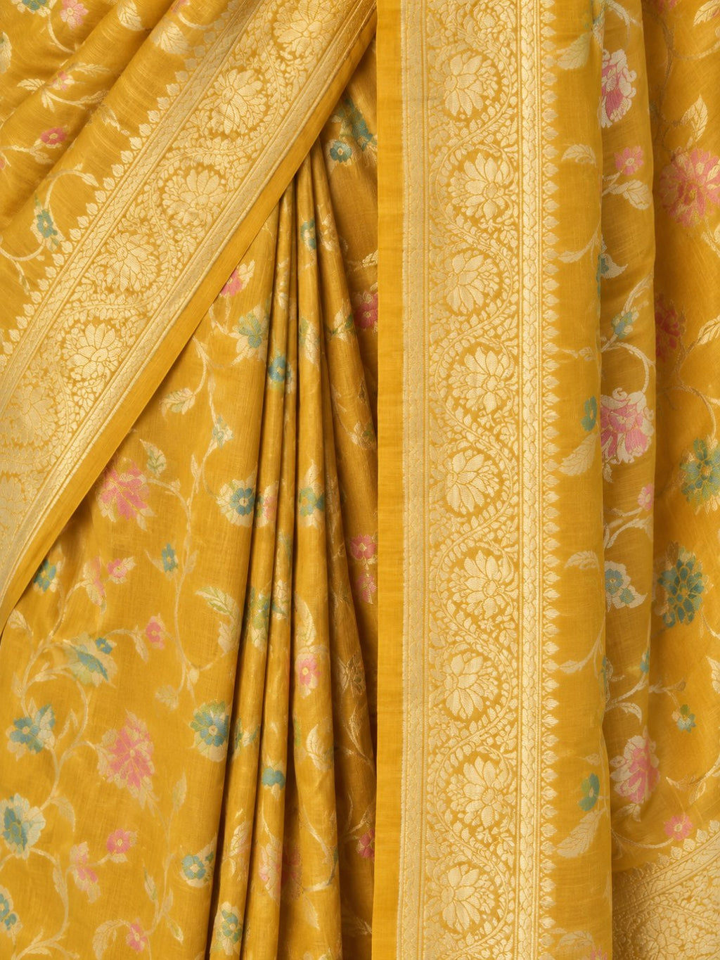 Mustard yellow with gold-toned zari and pastel pink, teal and green detailing Tussar Silk Banarasi saree texture detail