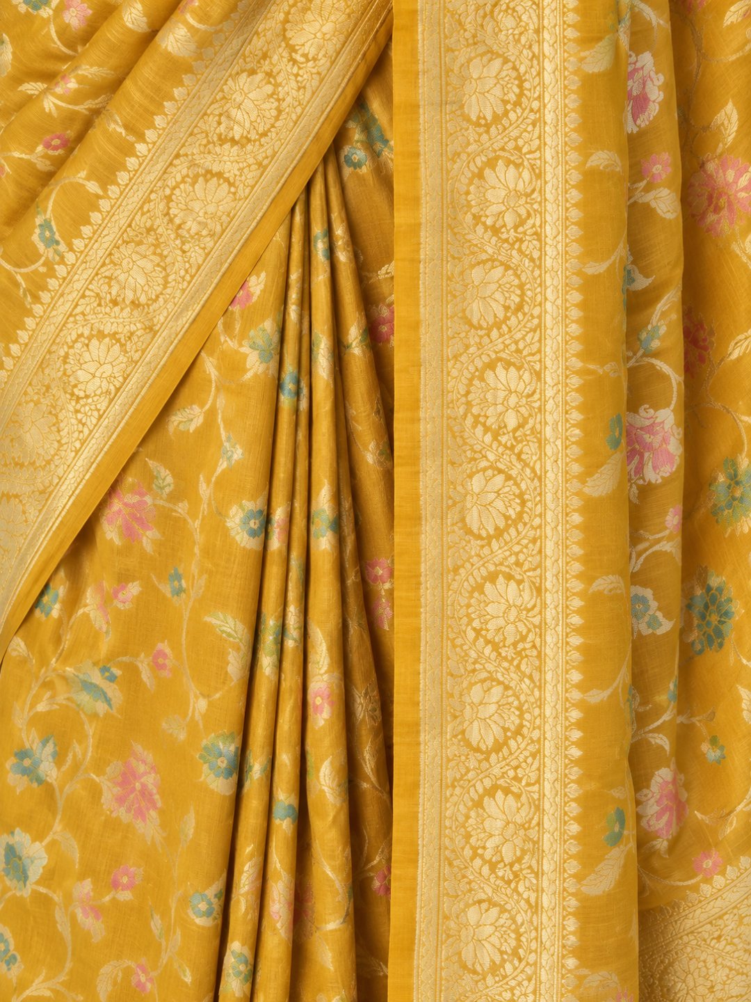 Mustard yellow with gold-toned zari and pastel pink, teal and green detailing Tussar Silk Banarasi saree texture detail