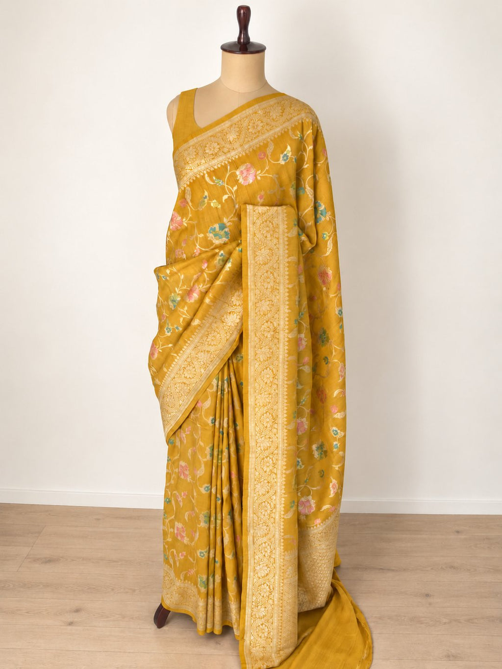 Mustard yellow with gold-toned zari and pastel pink, teal and green detailing Tussar Silk Banarasi saree pallu detail
