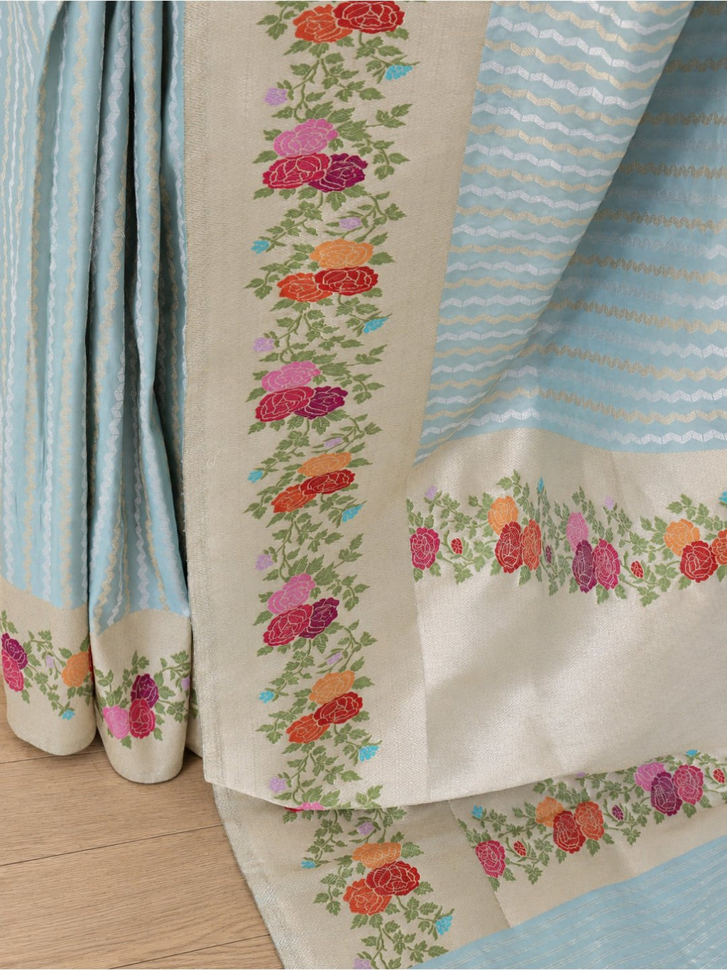 Powder aqua blue with a cream-gold border Katan Silk Banarasi saree front drape view