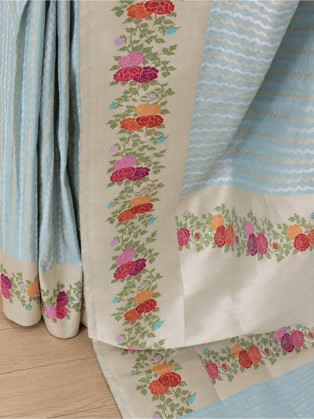 Powder aqua blue with a cream-gold border Katan Silk Banarasi saree front drape view