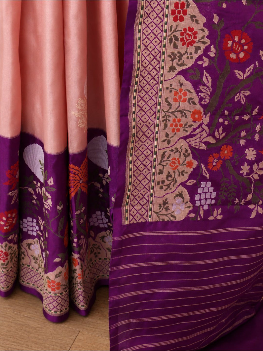 Soft peach-pink body with a rich purple borde Katan Silk Banarasi saree folded view