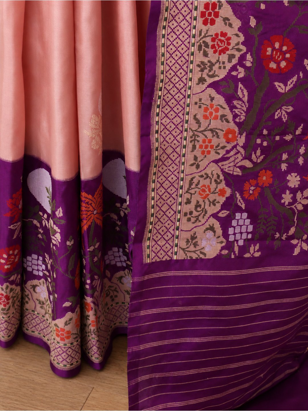 Soft peach-pink body with a rich purple borde Katan Silk Banarasi saree folded view