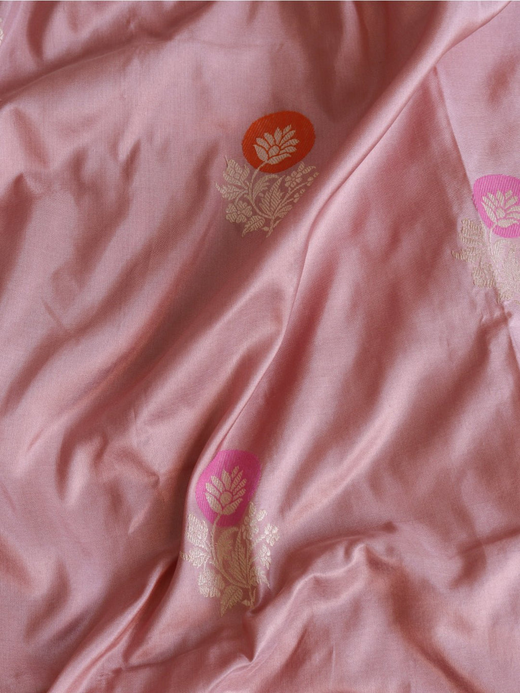 Soft peach-pink body with a rich purple borde Katan Silk Banarasi saree border closeup
