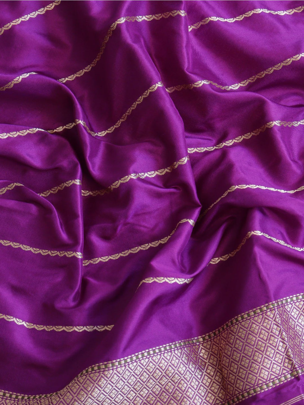 Soft peach-pink body with a rich purple borde Katan Silk Banarasi saree front drape view