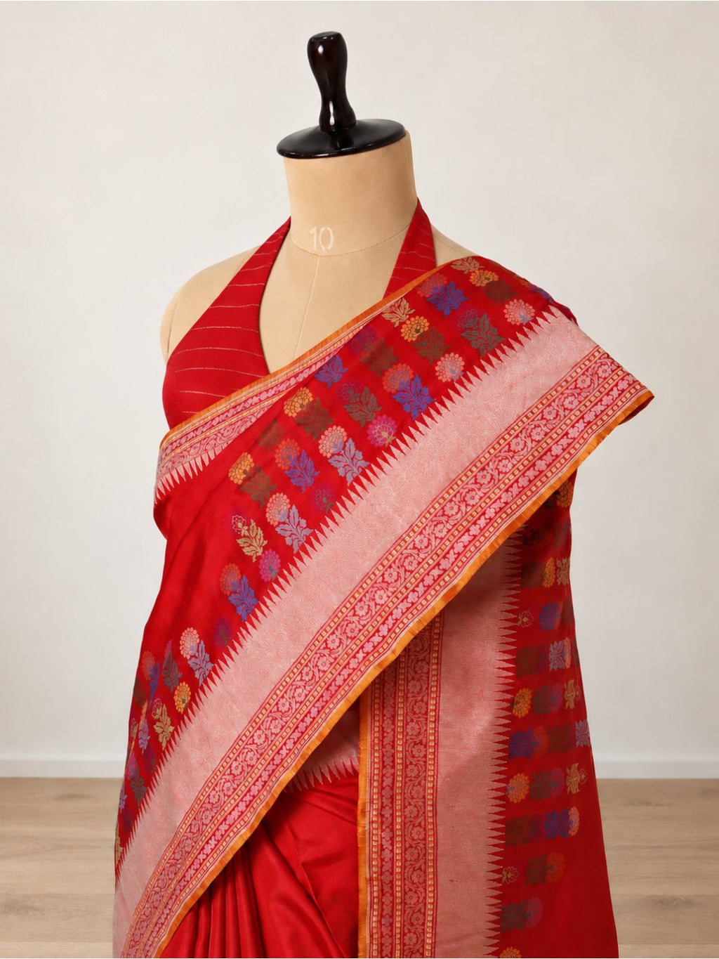 Vibrant red-orange with light gold zari Katan Silk Banarasi saree border closeup