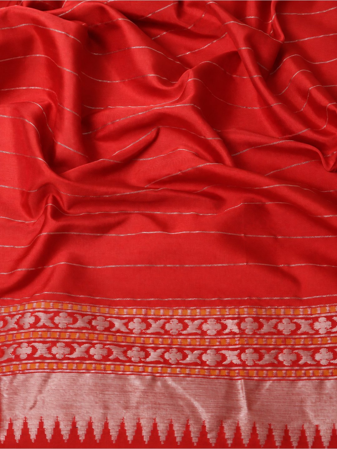 Vibrant red-orange with light gold zari Katan Silk Banarasi saree folded view