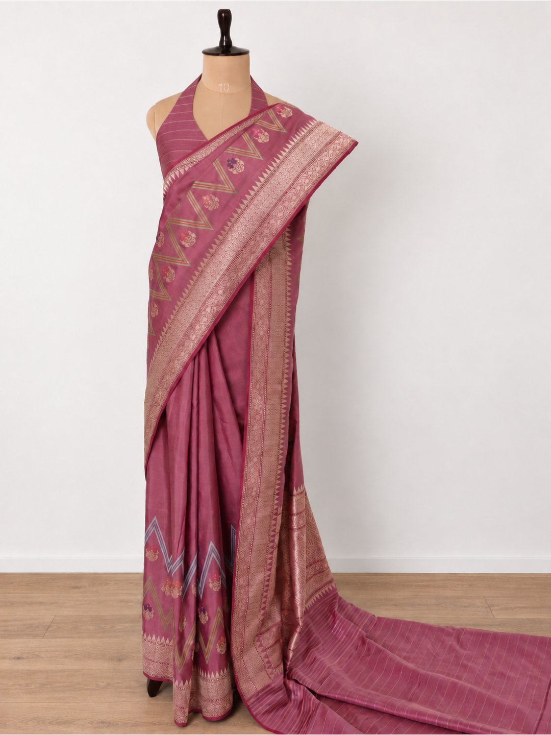 Dusty rose with a mauve undertone, gold zari Katan Silk Banarasi saree border closeup